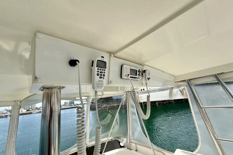 Slide: The Image of 1998 Riviera 34 Convertible yacht interior with communication equipment and ocean view. - 10