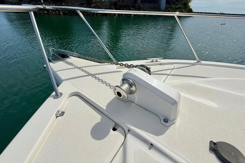 Slide: The Image of Bow of 1998 Riviera 34 Convertible yacht with anchor chain and winch. - 12