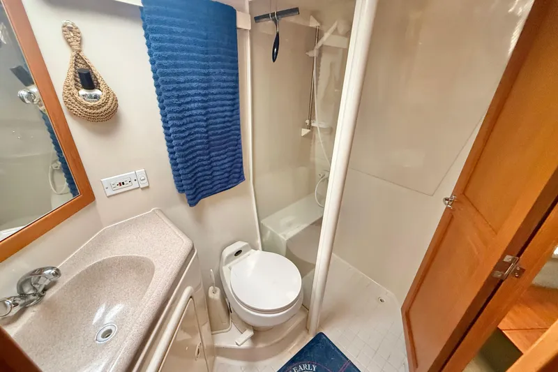 Slide: The Image of Bathroom interior of 1998 Riviera 34 Convertible yacht with shower and sink. - 25