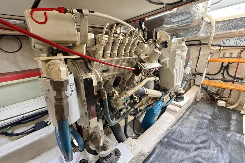 Slide: The Image of Engine room of a 1998 Riviera 34 Convertible boat, showcasing detailed machinery. - 38