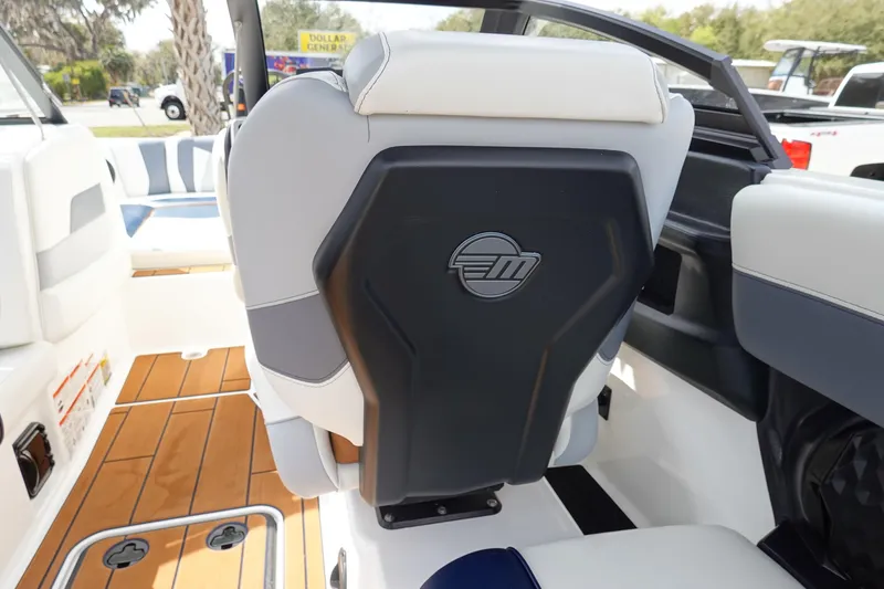 Slide: The Image of 2022 Malibu Wakesetter 23 MXZ interior with stylish seating and wood flooring. - 11