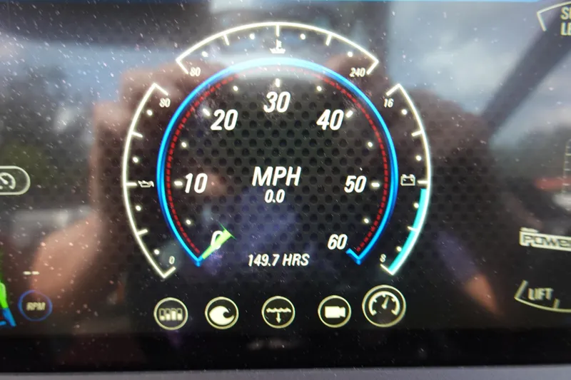 Slide: The Image of 2022 Malibu Wakesetter 23 MXZ speedometer displaying 0 MPH and 149.7 hours usage. - 13