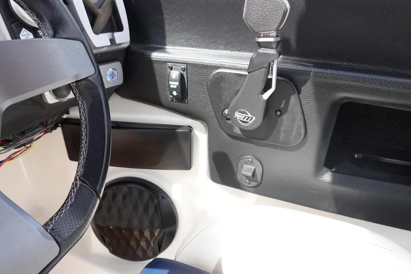 Slide: The Image of 2022 Malibu Wakesetter 23 MXZ dashboard with steering wheel and control panel. - 15