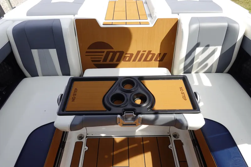 Slide: The Image of 2022 Malibu Wakesetter 23 MXZ boat interior with cup holders and "No Step" warning. - 21