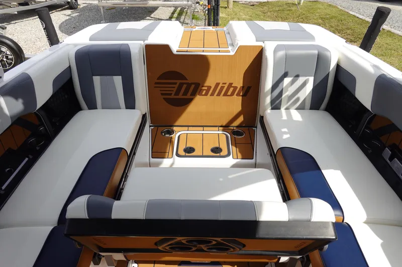 Slide: The Image of 2022 Malibu Wakesetter 23 MXZ boat interior with stylish seating and cup holders. - 22