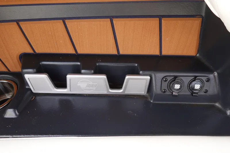 Slide: The Image of 2022 Malibu Wakesetter 23 MXZ interior detail with cup holder and control panel. - 25