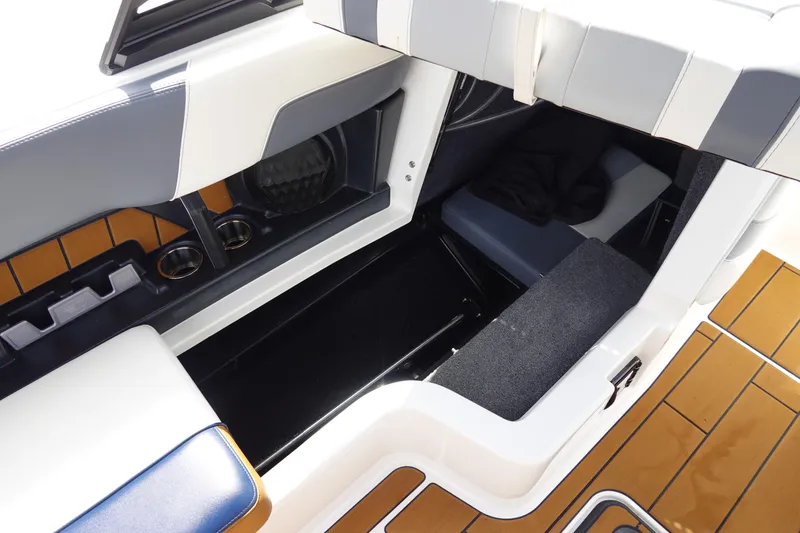 Slide: The Image of Interior view of 2022 Malibu Wakesetter 23 MXZ boat with seating and storage. - 29