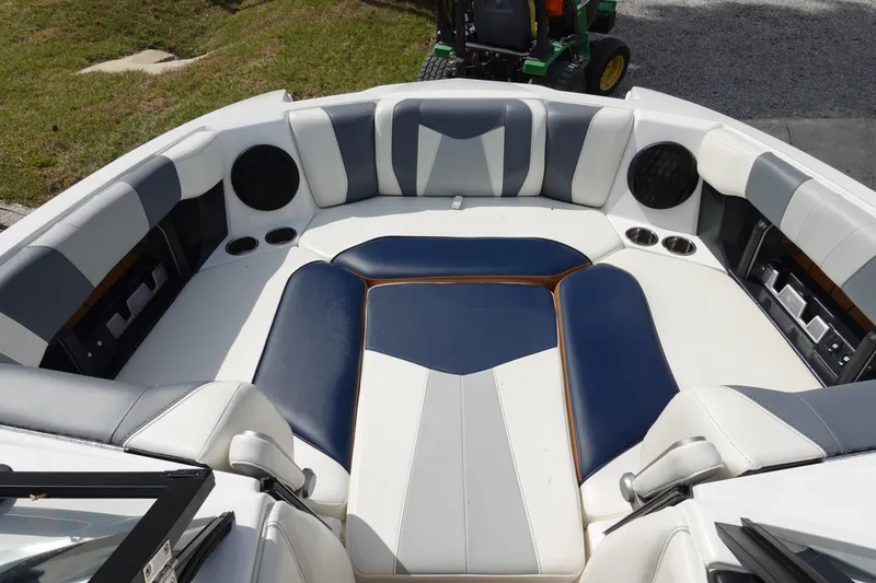Slide: The Image of 2022 Malibu Wakesetter 23 MXZ boat interior with stylish seating and cup holders. - 34