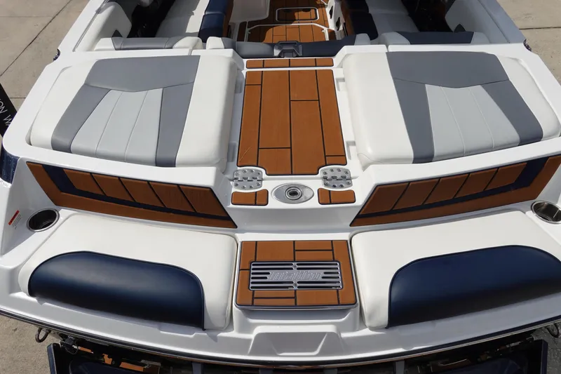Slide: The Image of 2022 Malibu Wakesetter 23 MXZ boat interior with sleek seating and stylish design. - 7