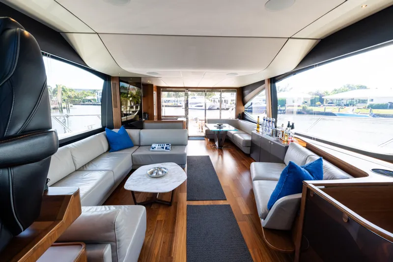 Slide: The Image of Luxurious interior of 2019 Princess S78 yacht with elegant seating and panoramic windows. - 10