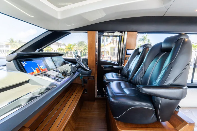 Slide: The Image of Luxurious 2019 Princess S78 yacht helm with leather seats and advanced navigation displays. - 11