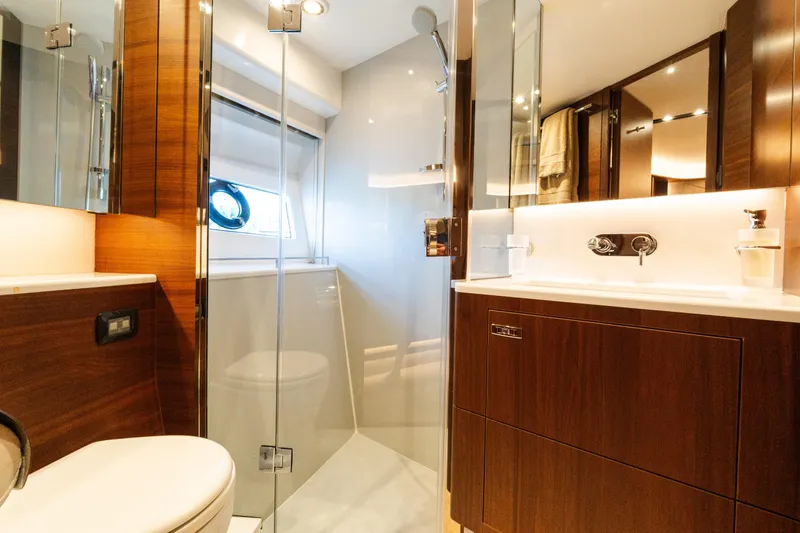 Slide: The Image of Luxurious bathroom in 2019 Princess S78 yacht with modern fixtures and wooden cabinetry. - 19
