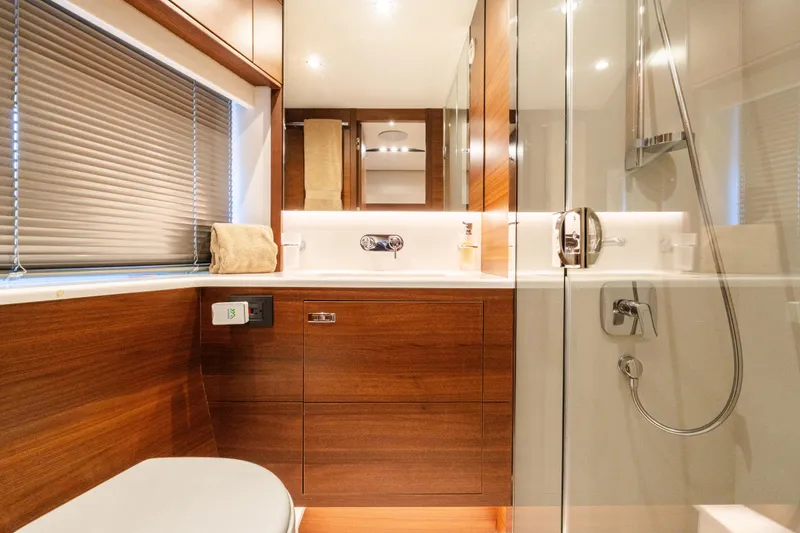 Slide: The Image of Luxurious bathroom interior of 2019 Princess S78 yacht with wood accents and modern fixtures. - 21