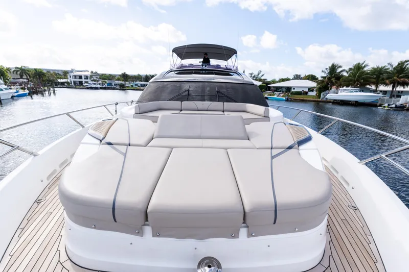 Slide: The Image of Luxurious 2019 Princess S78 yacht with spacious sunbathing deck, docked by palm-lined waterfront. - 32