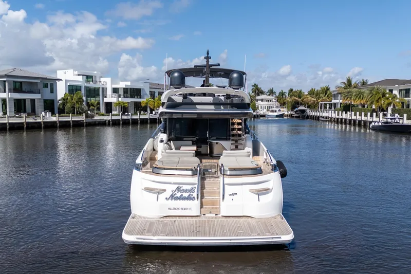 Slide: The Image of Luxurious 2019 Princess S78 yacht docked in scenic waterfront setting. - 33