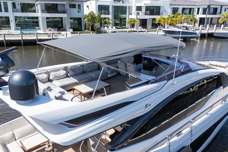 Slide: The Image of Luxurious 2019 Princess S78 yacht docked near modern waterfront homes. - 35