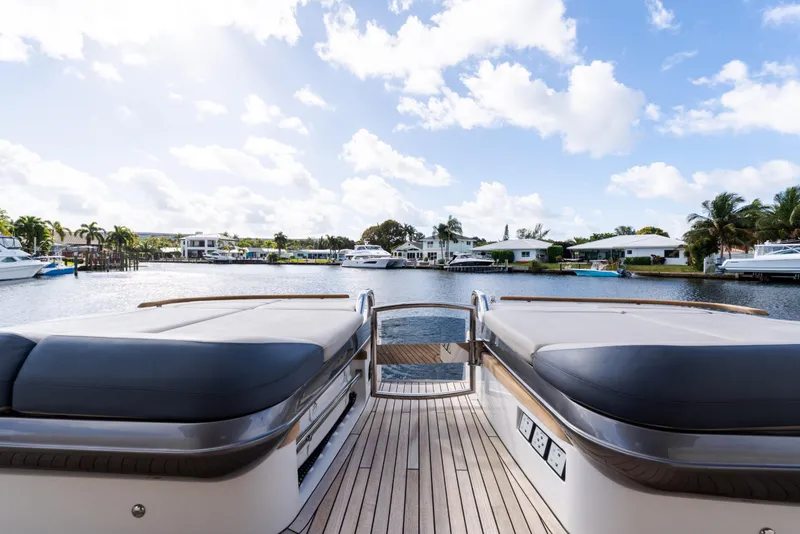 Slide: The Image of 2019 Princess S78 yacht deck with waterfront view, clear sky, and luxurious seating. - 5