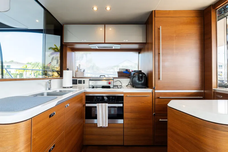 Slide: The Image of Luxurious kitchen interior of 2019 Princess S78 yacht with modern appliances and wooden cabinetry. - 7