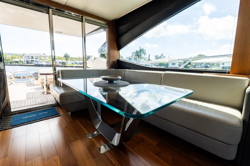 Slide: The Image of Luxurious interior of 2019 Princess S78 yacht with glass table and waterfront view. - 8