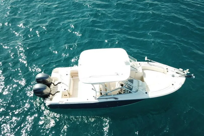 Slide: The Image of 2018 Grady-White Freedom 255 boat on clear blue water, aerial view. - 4