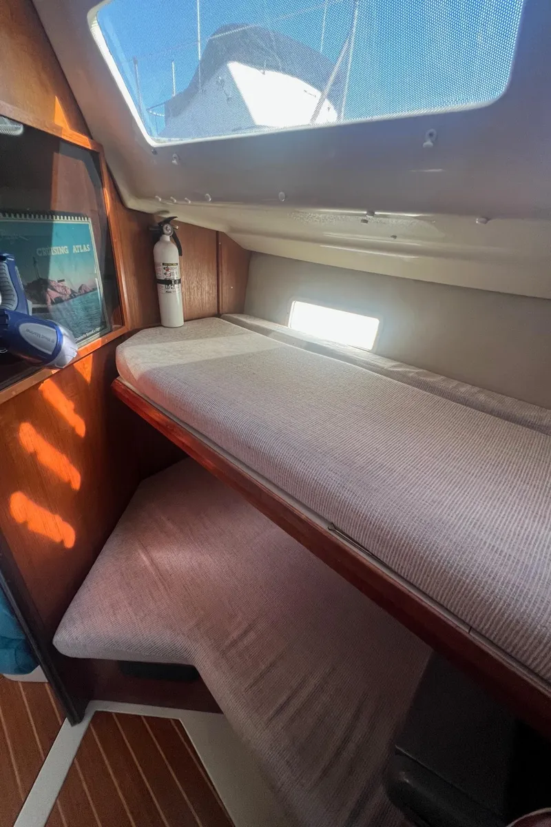Slide: The Image of Interior cabin of 1992 Hunter 43 sailboat with bunk beds and window. - 20