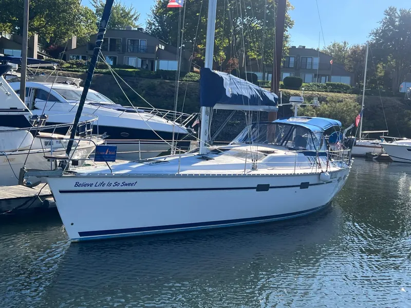 Slide: The Image of Sailboat docked in marina, 1992 Hunter 43 model, sunny day, residential backdrop. - 26