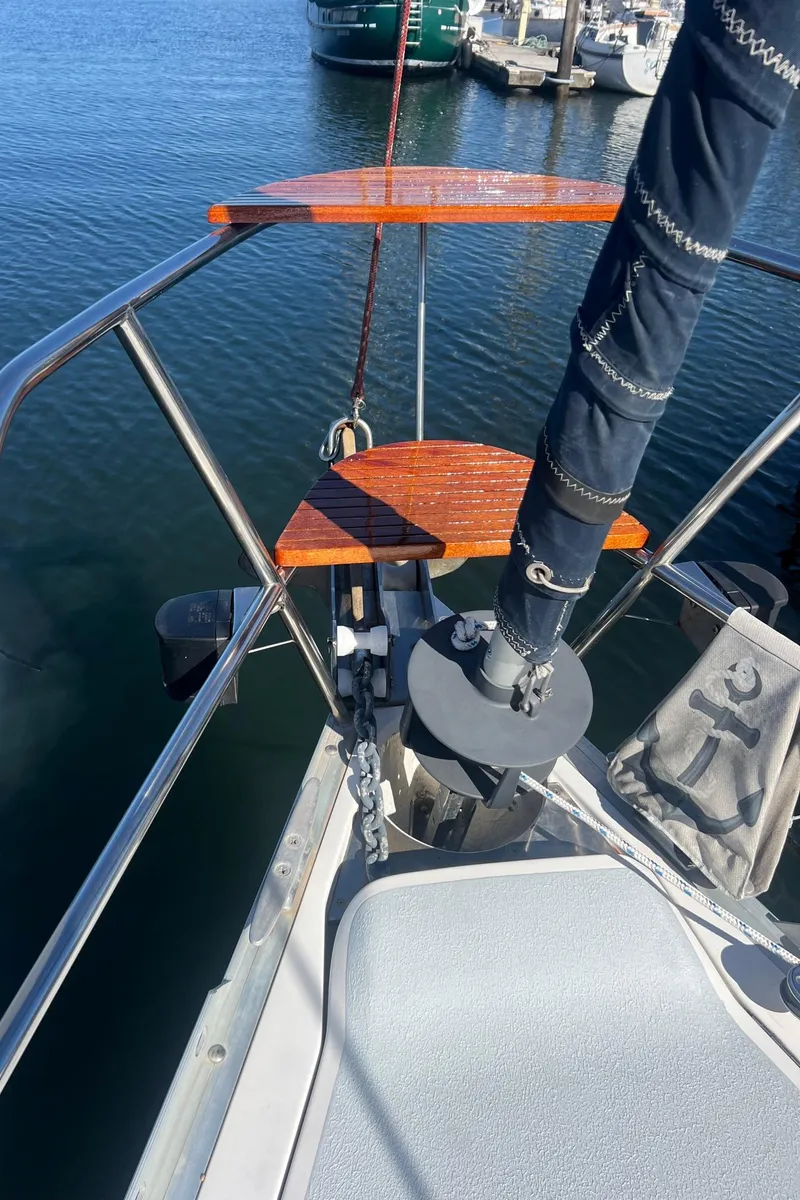 Slide: The Image of Bow of a 1992 Hunter 43 sailboat with anchor and teak steps. - 27