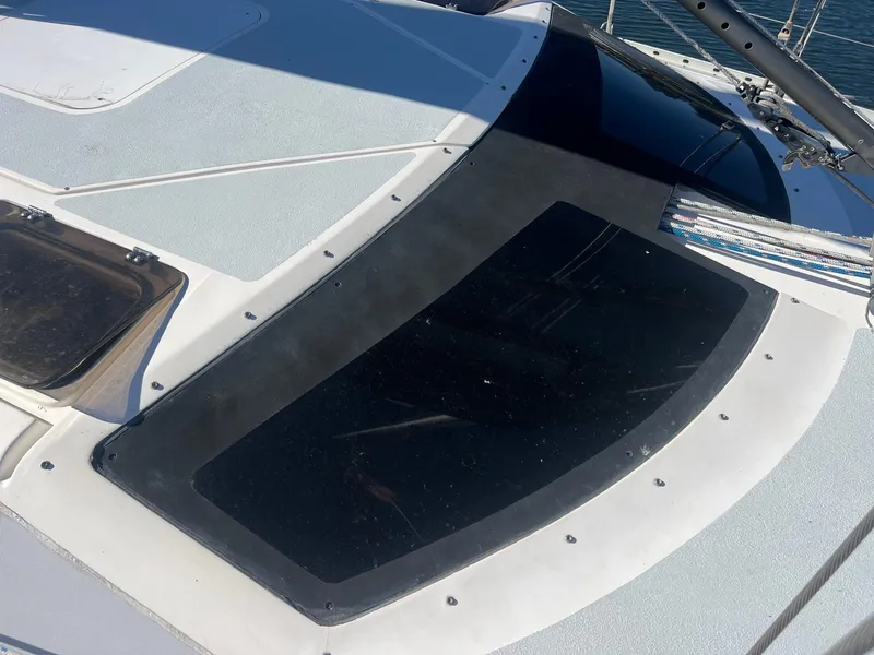 Slide: The Image of Deck of 1992 Hunter 43 sailboat with black window panel. - 33