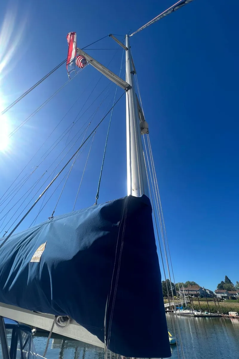 Slide: The Image of Sailboat mast of 1992 Hunter 43 under clear blue sky. - 34