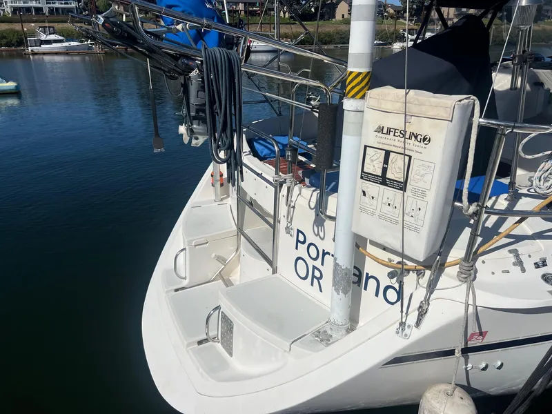 Slide: The Image of Hunter 43 sailboat, 1992 model, docked with lifesaving equipment visible. - 43