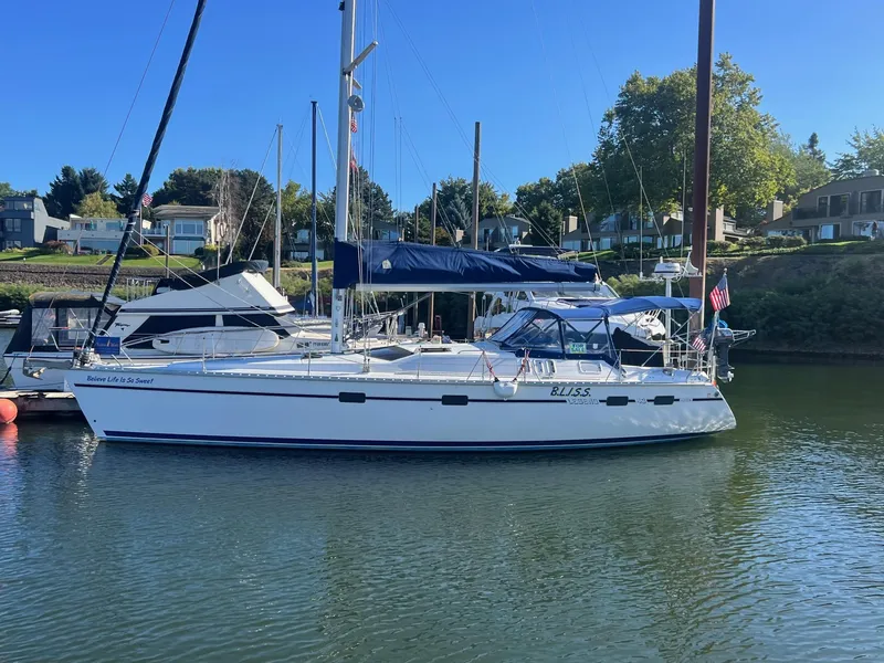 Slide: The Image of Sailboat docked in marina, 1992 Hunter 43 model, clear day, calm water. - 44