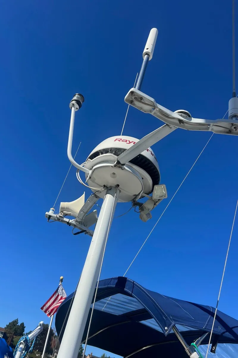 Slide: The Image of Radar and antennas on a 1992 Hunter 43 sailboat against a clear blue sky. - 47