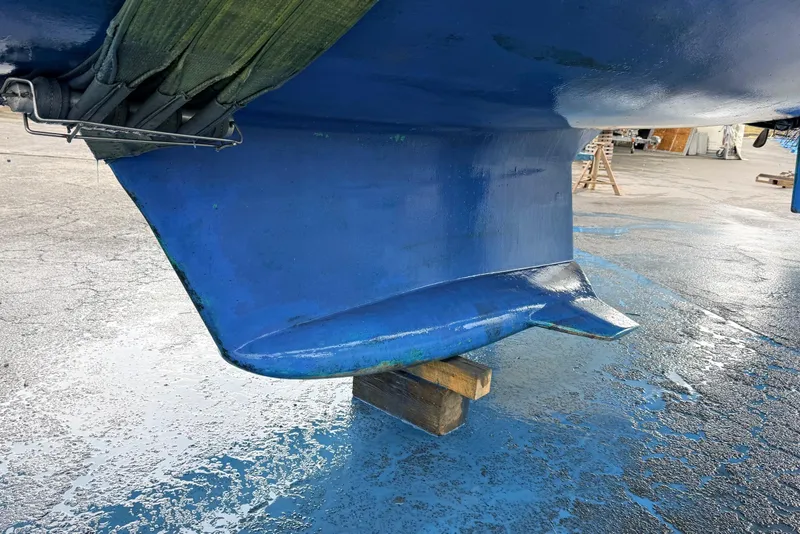 Slide: The Image of Blue keel of 1992 Hunter Legend 43 sailboat on dry dock. - 51
