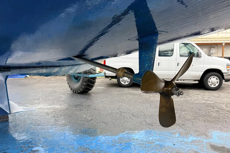 Slide: The Image of Propeller and rudder of 1992 Hunter Legend 43 sailboat on dry dock. - 52