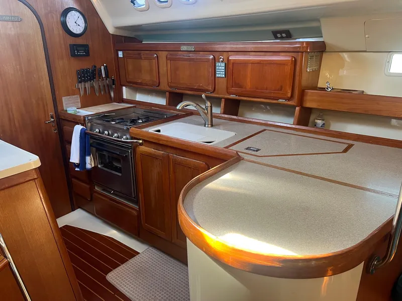 Slide: The Image of Spacious kitchen in 1992 Hunter 43 yacht with wooden cabinets and modern appliances. - 7