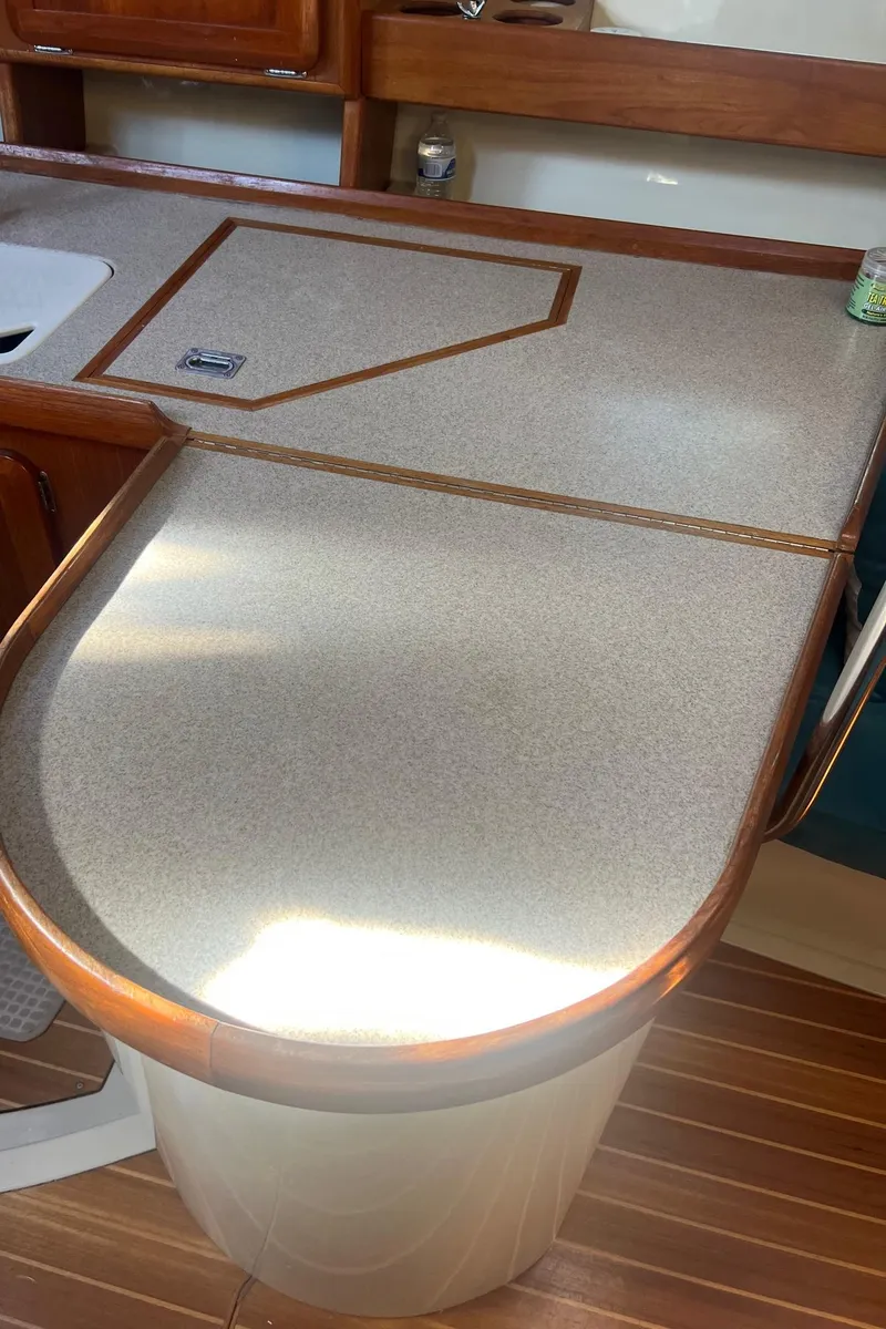 Slide: The Image of 1992 Hunter 43 yacht interior with wooden countertop and sink. - 9