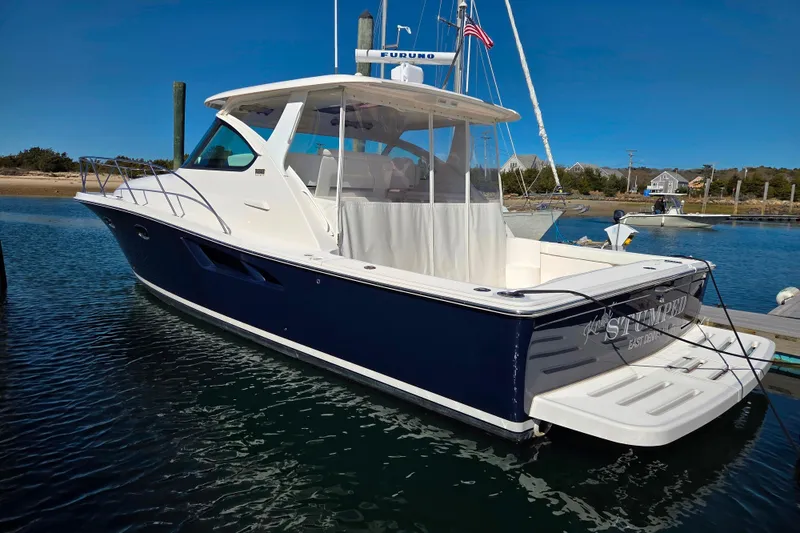 The Image of 2012 Tiara Yachts 3900 Open docked, featuring sleek design and spacious deck. - 0