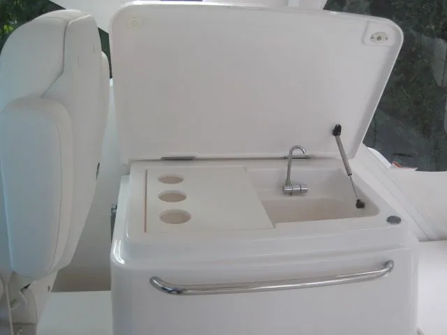Slide: The Image of 2012 Tiara Yachts 3900 Open with integrated sink and storage. - 13