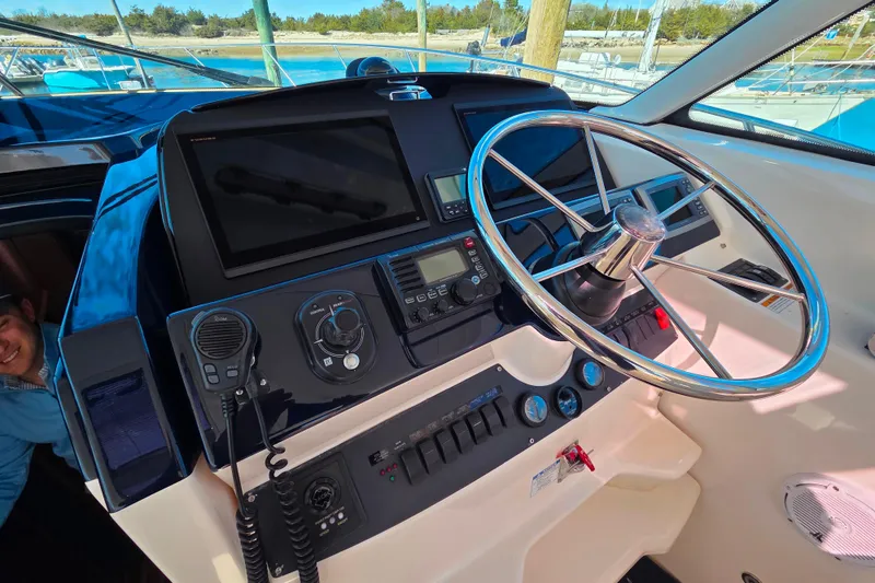 Slide: The Image of Helm of 2012 Tiara Yachts 3900 Open with modern navigation equipment and steering wheel. - 15