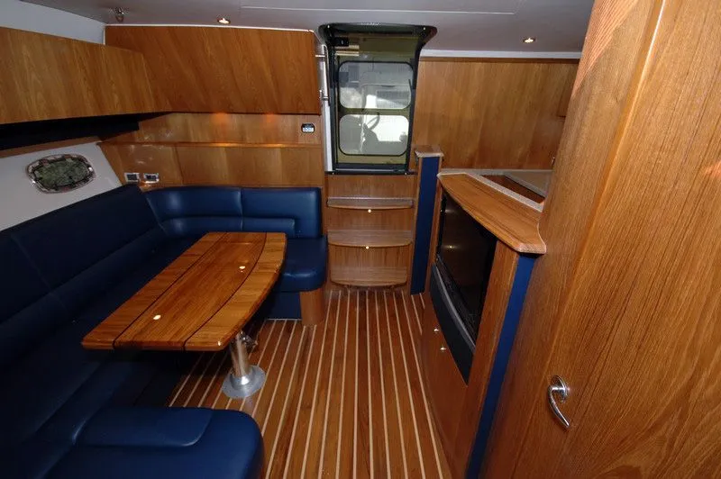 Slide: The Image of Interior of 2012 Tiara Yachts 3900 Open with wood finish. - 19
