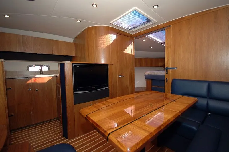 Slide: The Image of Interior of 2012 Tiara Yachts 3900 Open with wooden furnishings. - 20