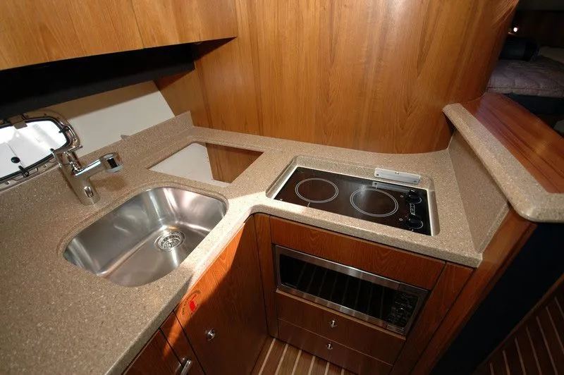 Slide: The Image of Interior of 2012 Tiara Yachts 3900 Open with kitchen and sink. - 22