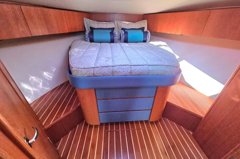 Slide: The Image of Luxurious cabin interior of 2012 Tiara Yachts 3900 Open with elegant wood finish. - 26