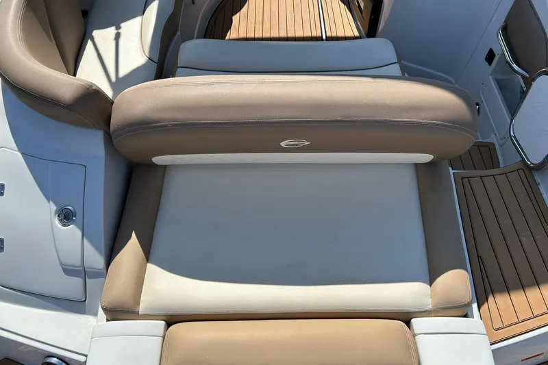 Slide: The Image of 2019 Crownline Eclipse E285 boat interior with tan and white seating. - 22