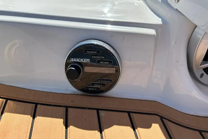 Slide: The Image of Kicker audio control panel on 2019 Crownline Eclipse E285 boat deck. - 24