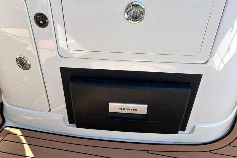 Slide: The Image of 2019 Crownline Eclipse E285 boat with Dometic cooler on deck. - 31