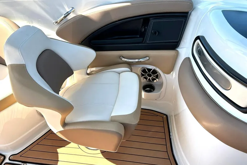 Slide: The Image of 2019 Crownline Eclipse E285 boat interior with beige and white seating. - 34