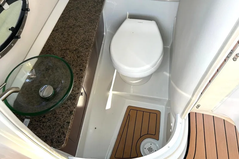 Slide: The Image of 2019 Crownline Eclipse E285 boat bathroom with modern sink and toilet. - 35