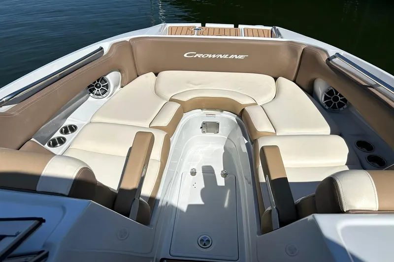 Slide: The Image of 2019 Crownline Eclipse E285 boat interior with beige seating and cup holders. - 40