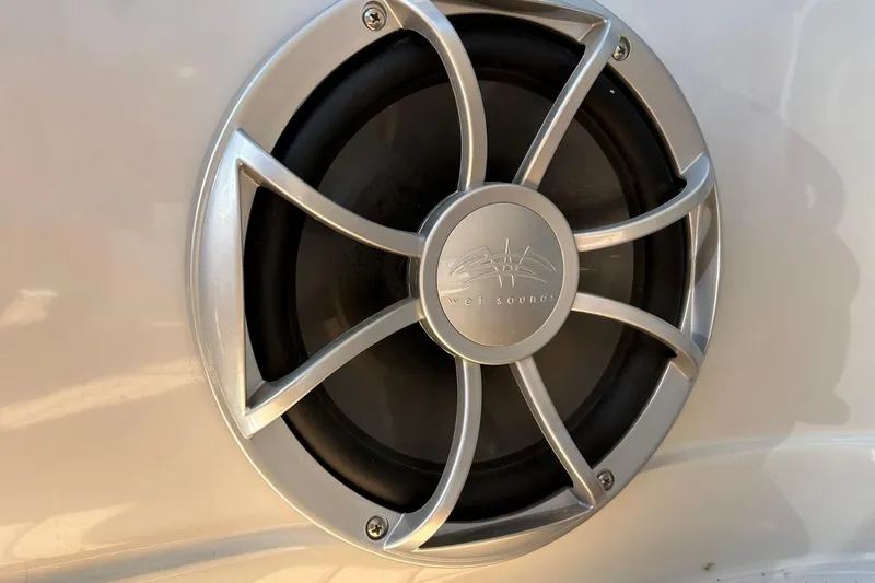 Slide: The Image of Close-up of a 2019 Crownline Eclipse E285 boat speaker with silver grille. - 47